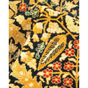 Close-up of a luxurious, floral patterned carpet with intricate details.