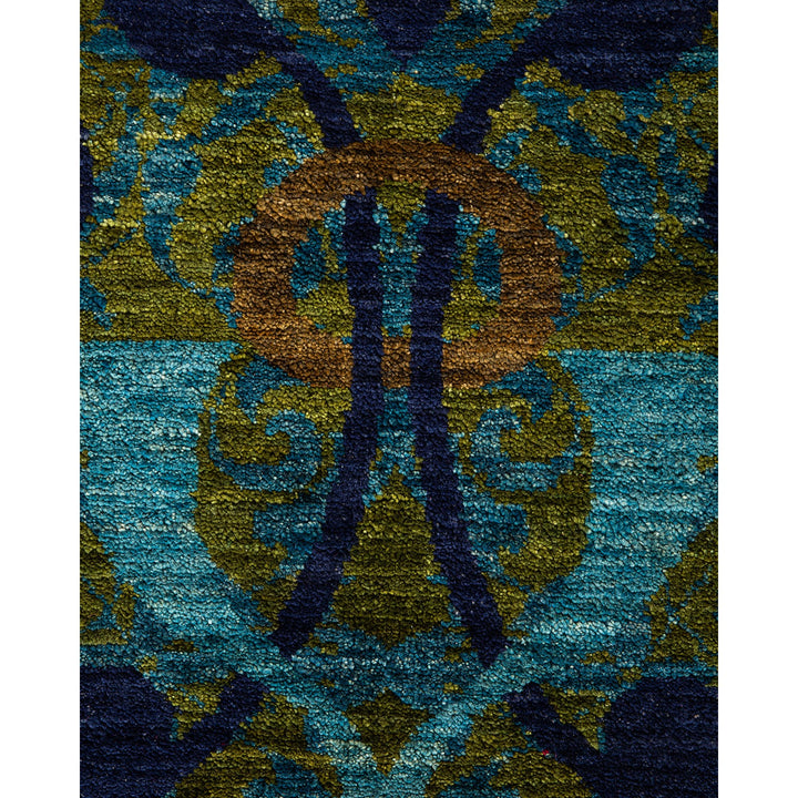 Close-up of a traditional-inspired rug with vibrant symmetrical pattern.