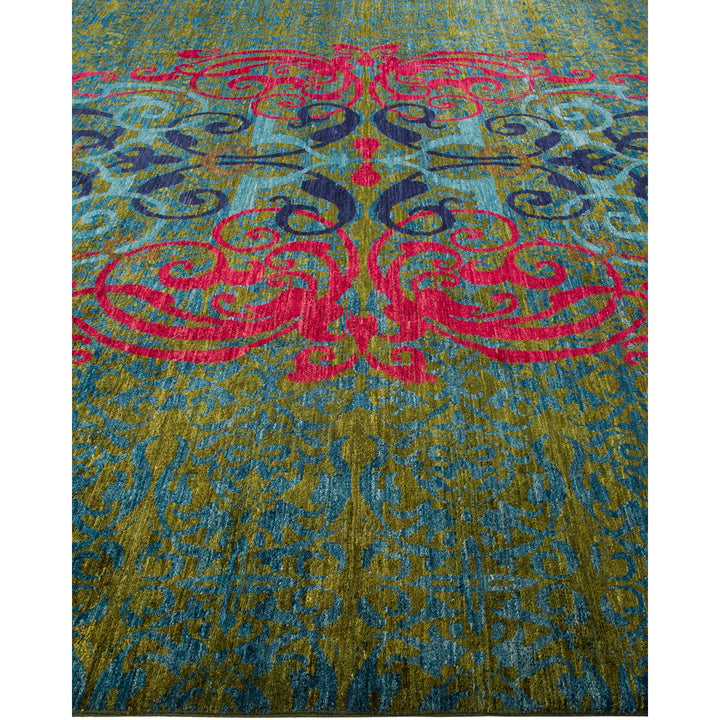 Intricate carpet with vibrant pink and blue floral pattern design.