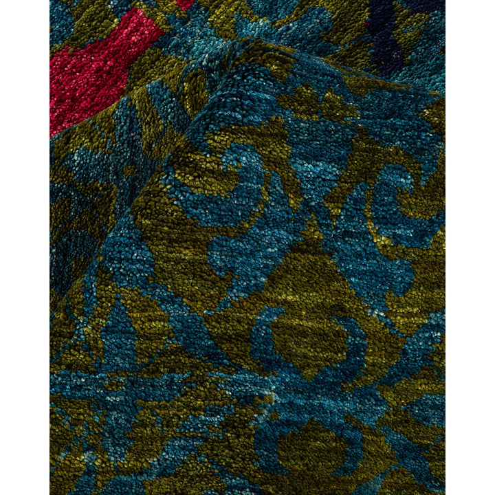 Close-up of a vibrant, intricate fabric with ornamental patterns.