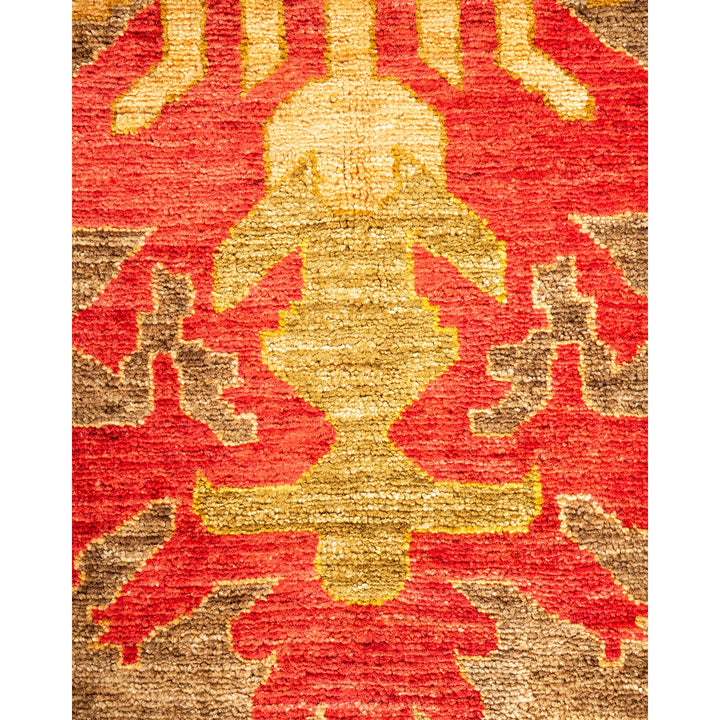 Close-up of a high-quality, symmetrical, red and gold fabric pattern