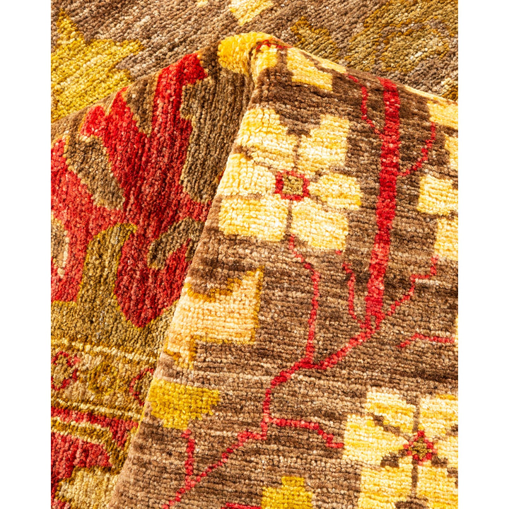 Close-up of a vibrant, intricately patterned handcrafted textile with plush pile.