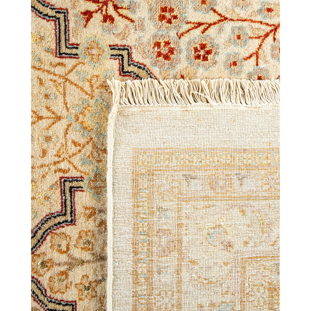 Intricate rug showcases traditional patterns, fringe, and expert craftsmanship.