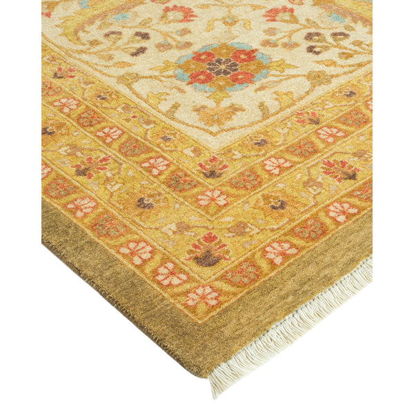 Corner view of a traditional, intricately patterned area rug.