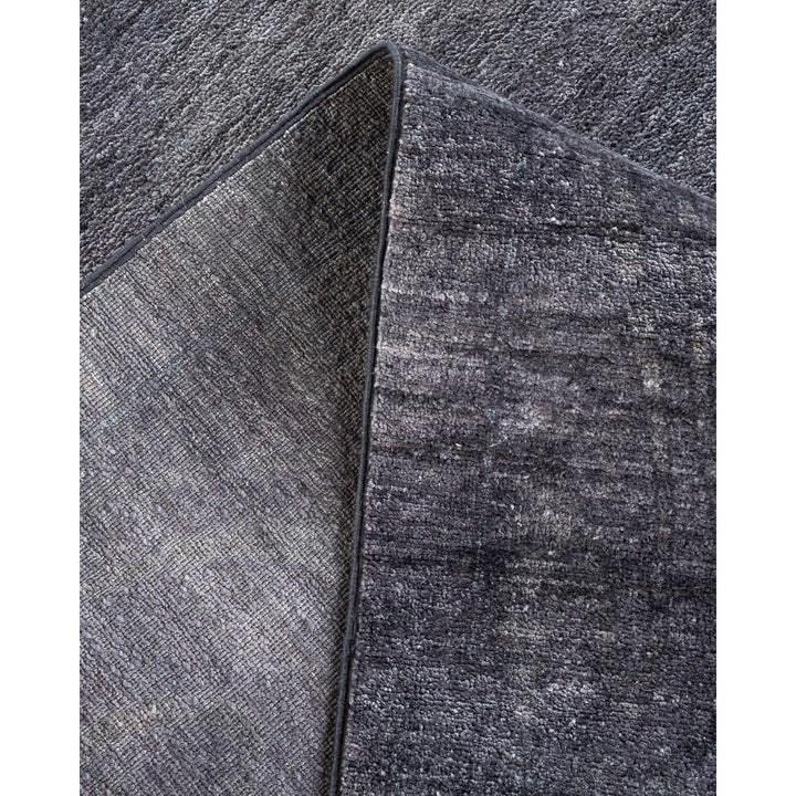 Comparison of two textured fabric sections in minimalist gray.