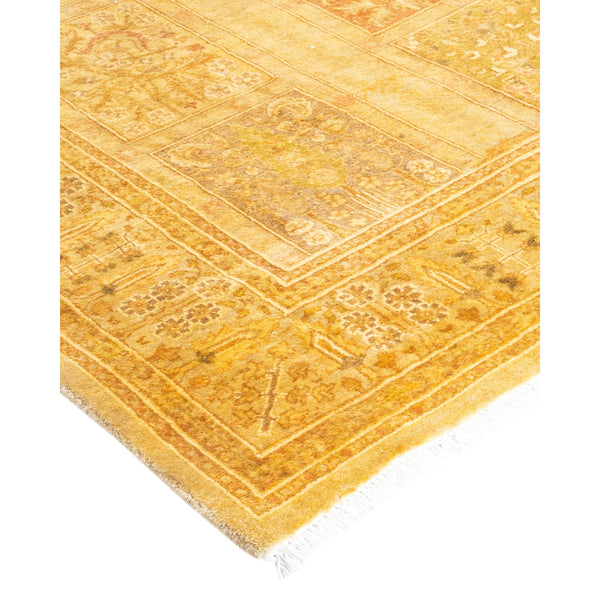 Ornate rug with intricate geometric patterns in yellow and gold.