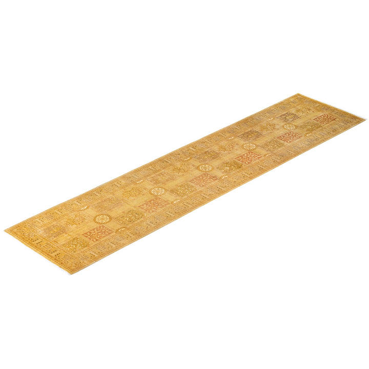 Decorative golden runner carpet with ornamental designs and floral motifs.