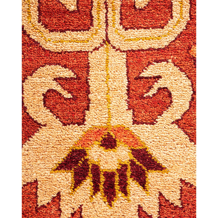 Close-up of a symmetrical, warm-toned textile with intricate pattern