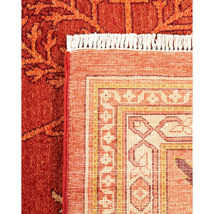 Close-up of two rugs with different patterns and textures overlapping.