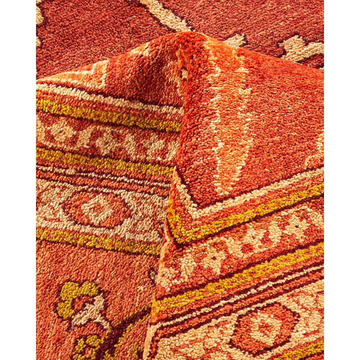 Close-up of a plush, patterned carpet with vibrant colors.