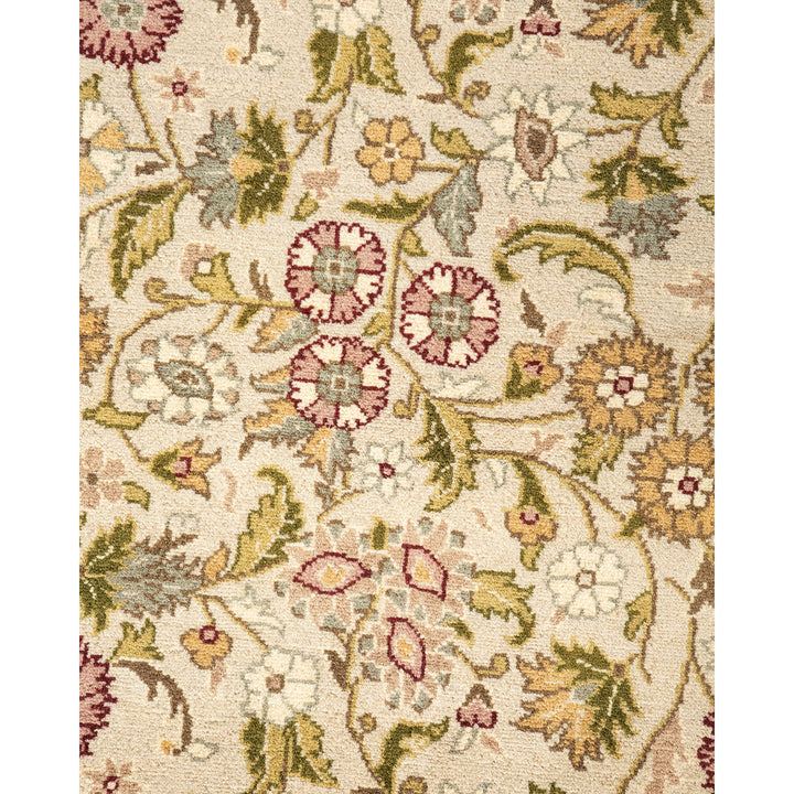 Intricate and traditional floral-patterned carpet with rich red and green hues.