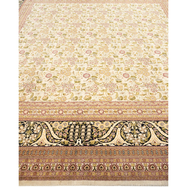 Exquisite hand-knotted rug with intricate floral motifs and elaborate border.