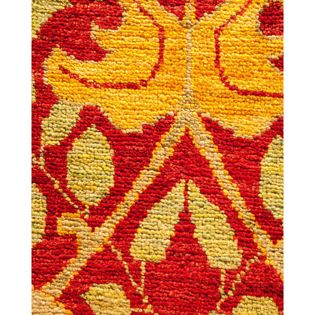 Close-up of a vibrant, ornamental carpet showcasing intricate craftsmanship.