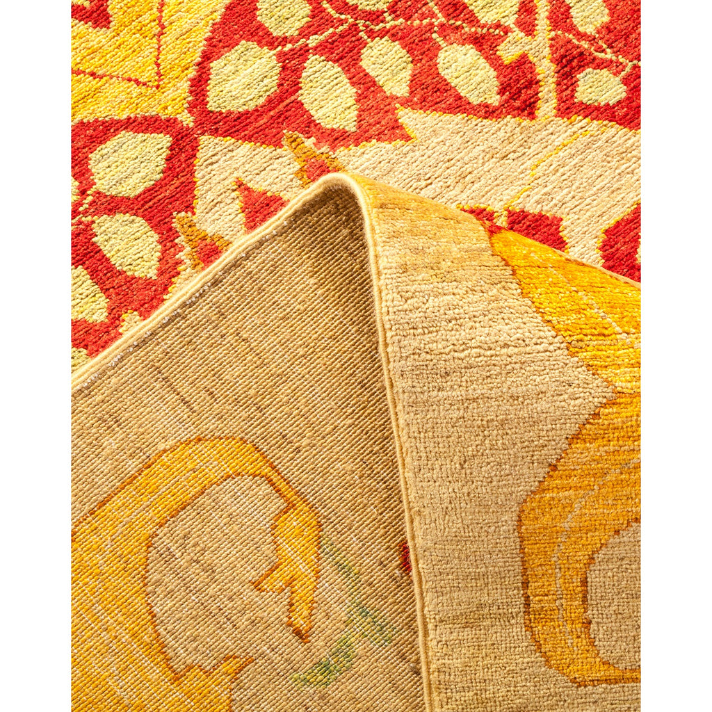 Close-up of a vibrant, hand-knotted rug showcasing intricate patterns and texture.