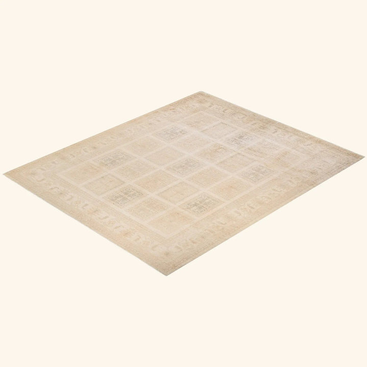 Neutral-toned, textured carpet with intricate square and rectangle patterns.