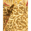 Close-up of a plush, golden fabric with intricate paisley pattern.
