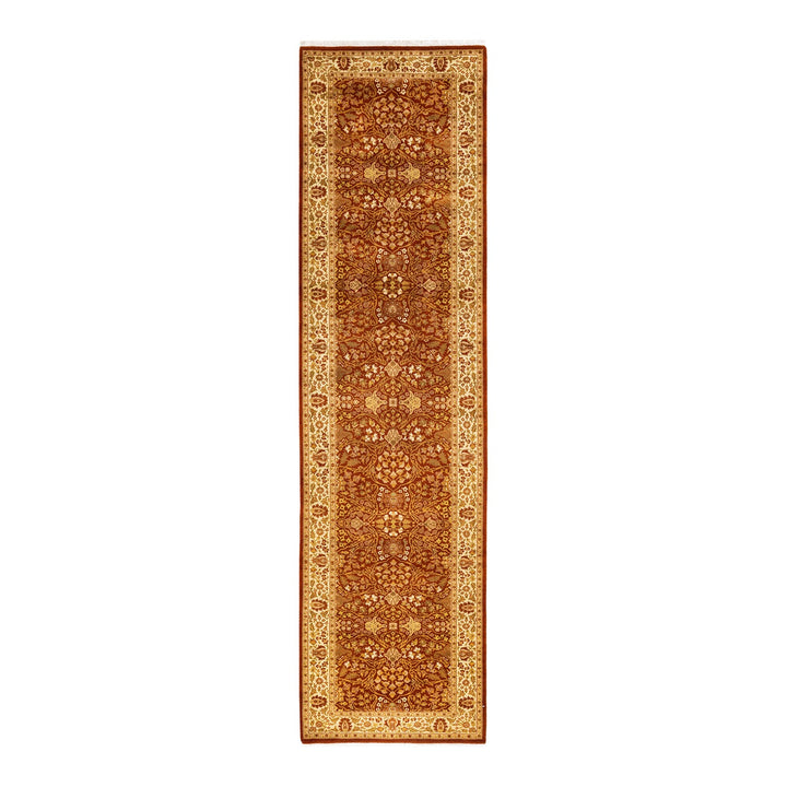 Narrow traditional-patterned rug with intricate floral motifs in warm colors.