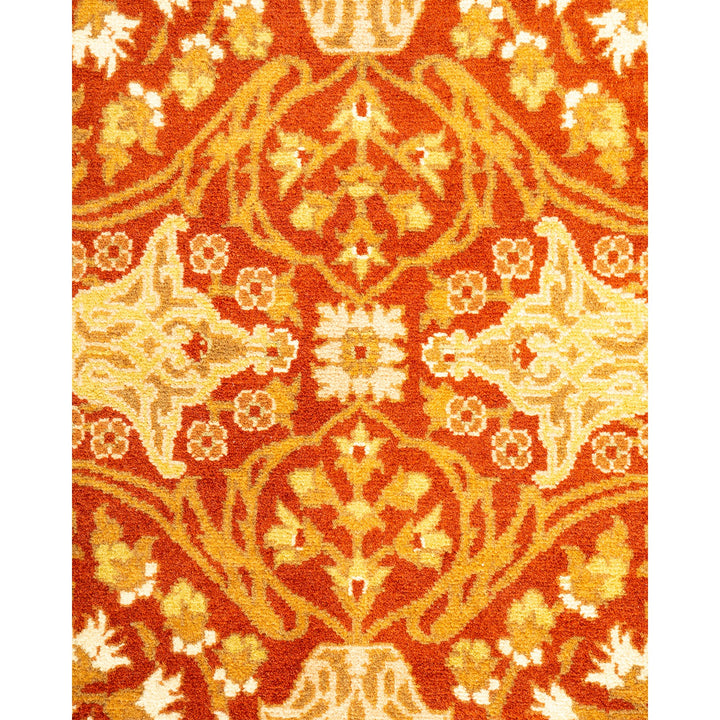 Close-up of a vibrant, ornate rug with floral patterns.