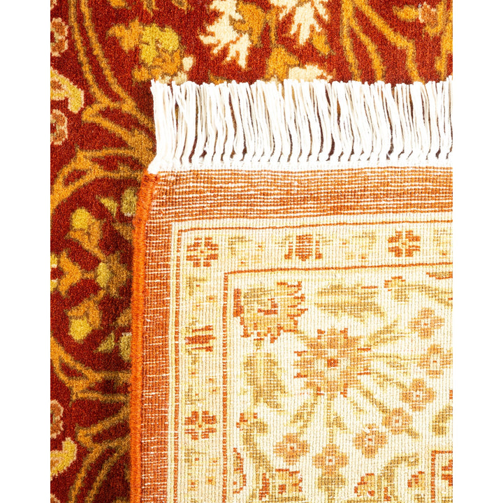 A close-up of two segments of textile with distinctive designs and colors, possibly from rugs or carpets, showcasing traditional Persian or Oriental styles.