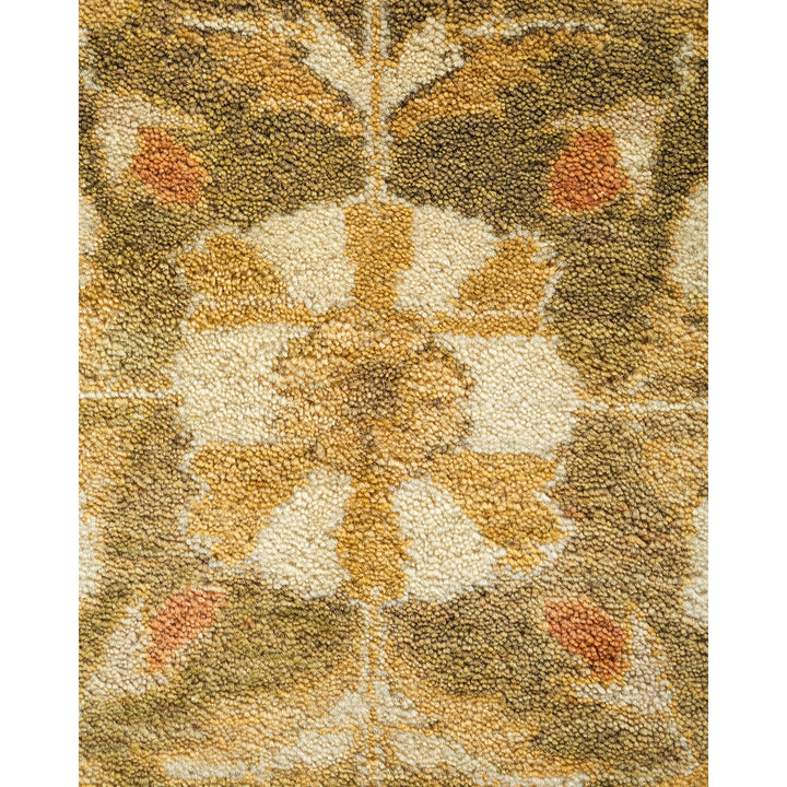 Close-up of a symmetrical floral pattern on a textured carpet.