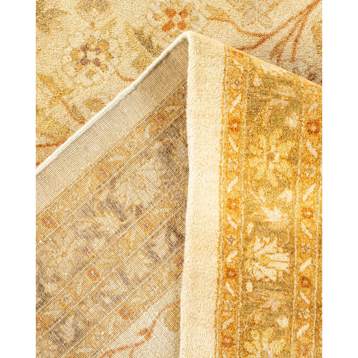 Close-up of a folded, intricately patterned vintage carpet with warmth