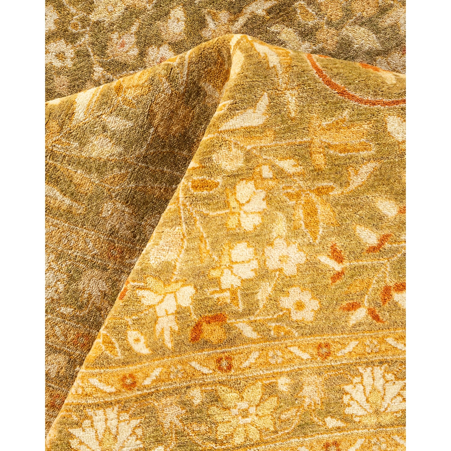 Close-up of intricately patterned fabric in shades of gold and brown.
