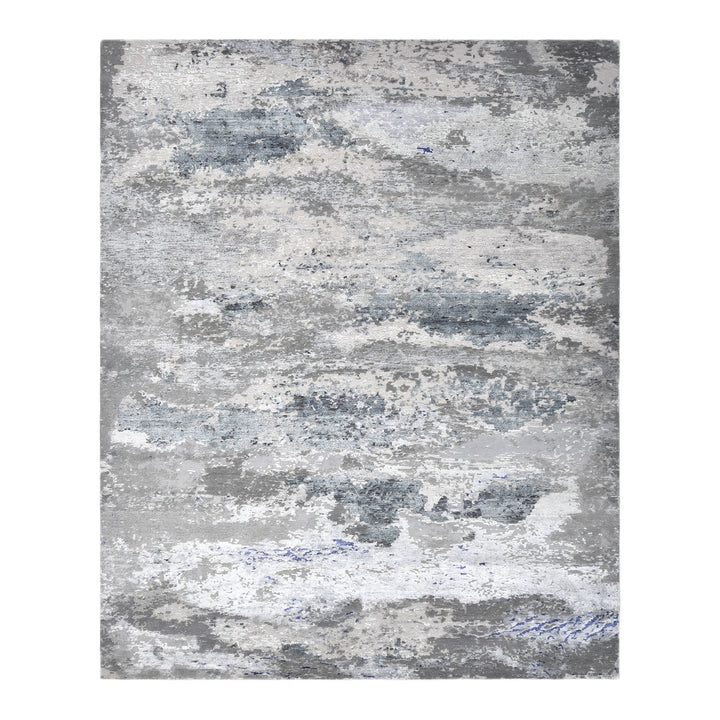Abstract rectangular rug with a distressed blue and grey design.