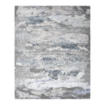 Abstract rectangular rug with a distressed blue and grey design.