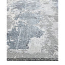 Contemporary rug with intricate grey and blue marble-like pattern.