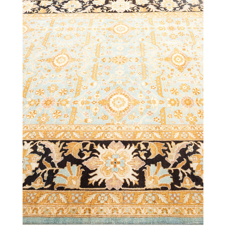 Intricate, ornate rug with central pale blue field and bold border.