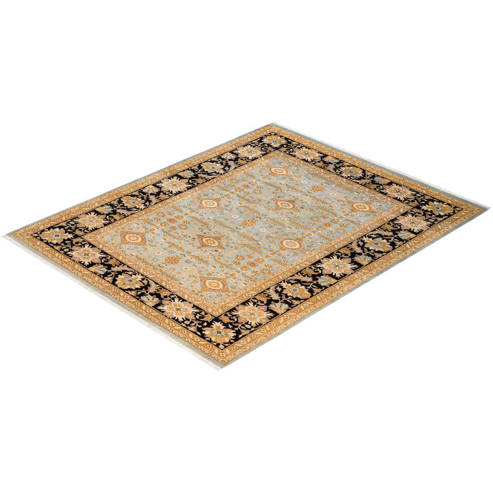 An intricately designed traditional area rug in blue and gold.
