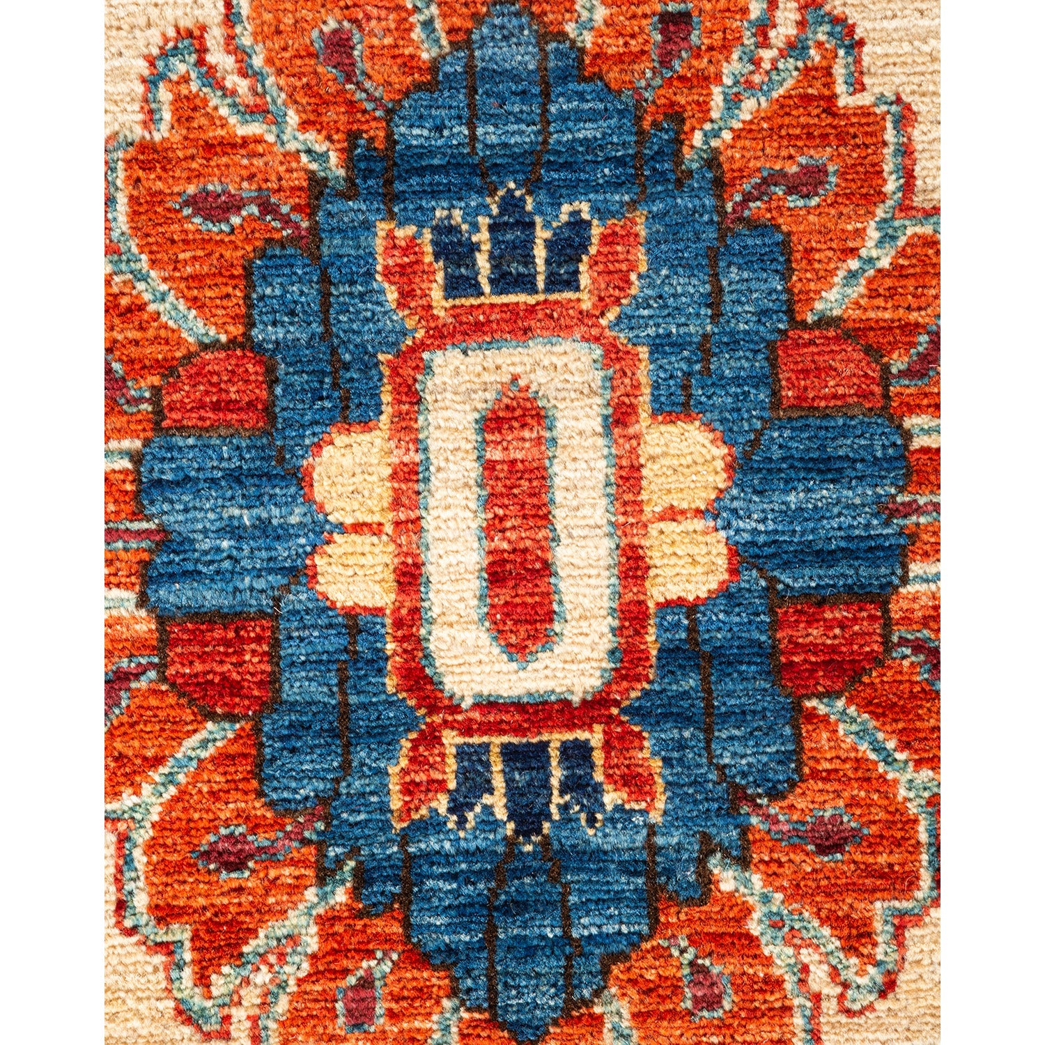 Close-up of a handmade symmetrical carpet with intricate design.