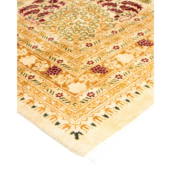 Intricate traditional carpet with geometric and floral patterns in rich tones.