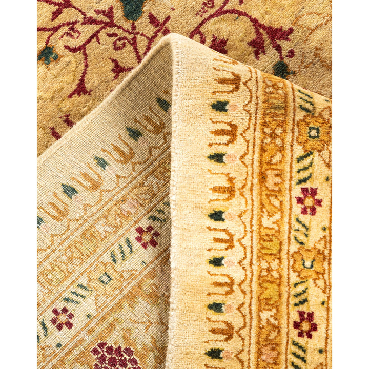 Close-up of a folded oriental rug showcases intricate traditional design.