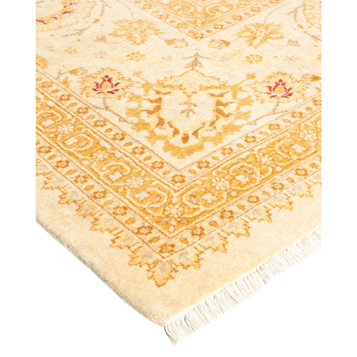 Elaborate traditional rug in beige and orange with symmetrical patterns