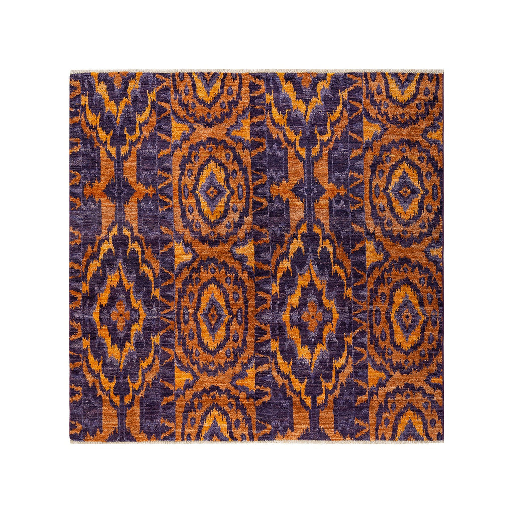 Symmetrical, ornate rectangular rug with purple and orange motifs.