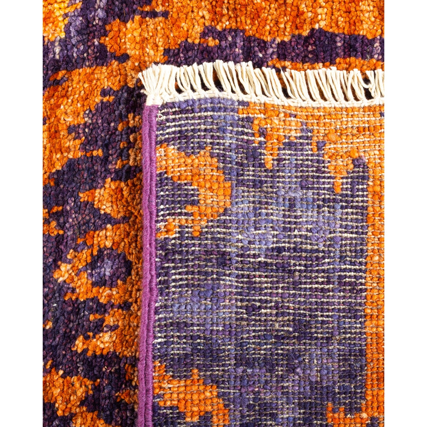 Close-up of vibrant patterned fabric with handmade textured weave.