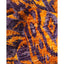 Vibrant purple and orange pattern on tufted, textured fabric.