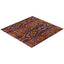 Rectangular rug with diamond-like shape and intricate purple-orange design.