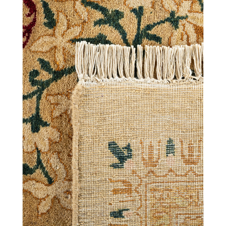 Close-up of a handcrafted woven rug with intricate floral motifs.