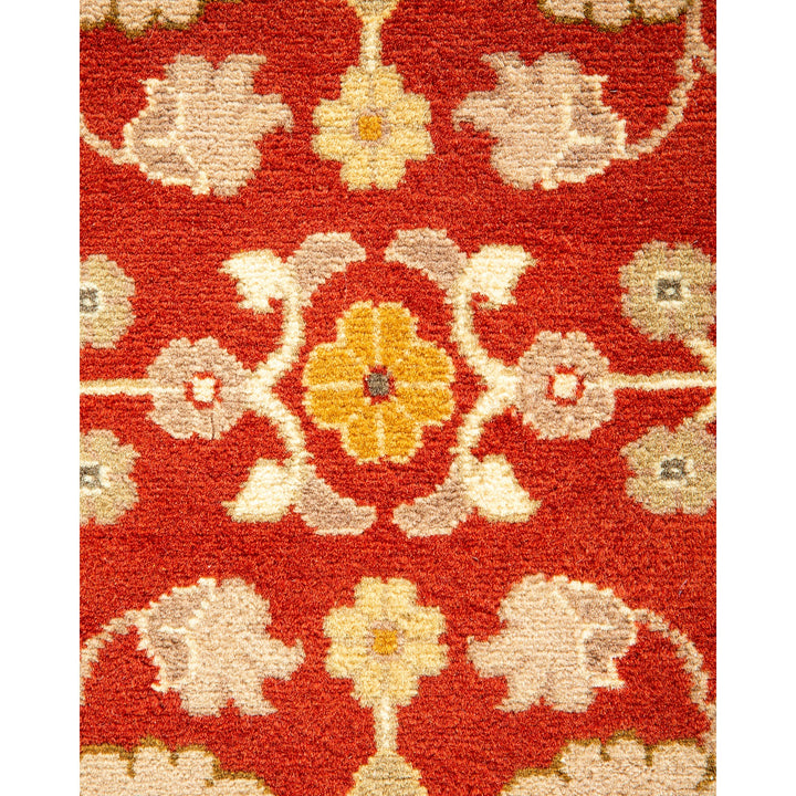 Close-up of a plush, intricate oriental-style carpet with floral pattern.