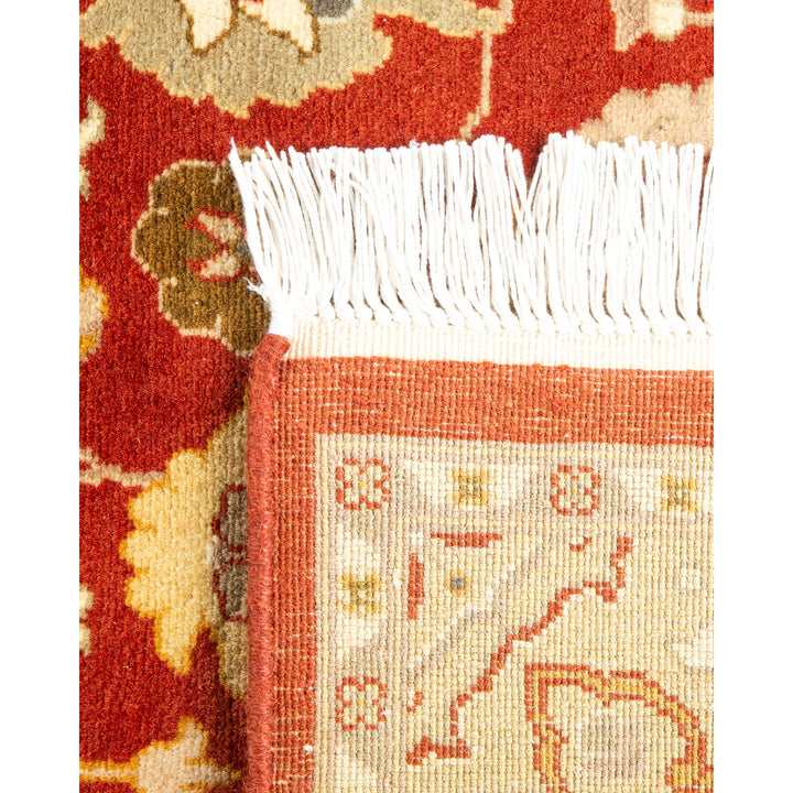 Close-up of a intricately patterned, handcrafted rug with vibrant colors.
