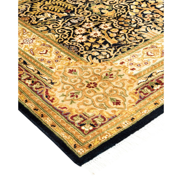 Close-up of ornate rug with intricate pattern and vibrant colors.