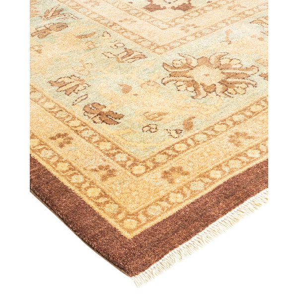 Ornate carpet with geometric and floral designs in beige and blue.