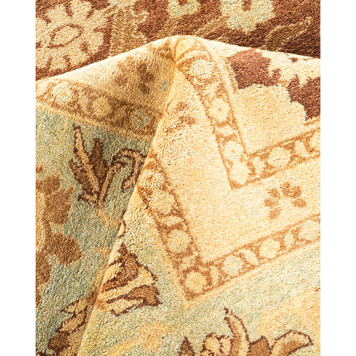 Close-up of plush area rug with folded corner, revealing underside.