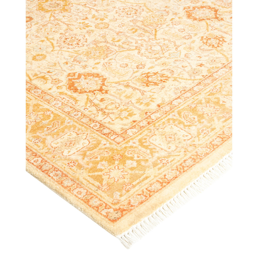 Faded vintage area rug with traditional design and ornate patterns.