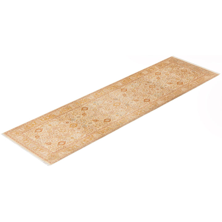 Ornate carpet runner with floral and abstract motifs in beige