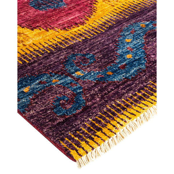 Vibrant and intricate rug with floral and abstract motifs.