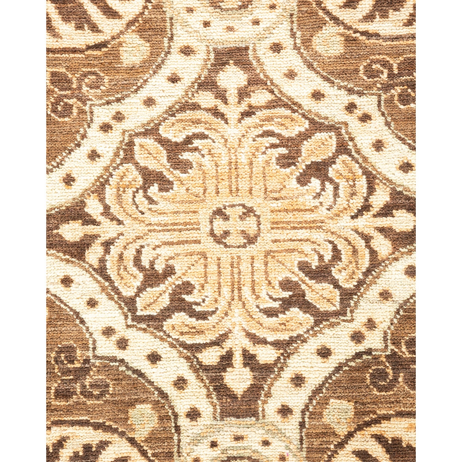 Close-up of traditional rug design with floral motifs in warm, neutral tones.