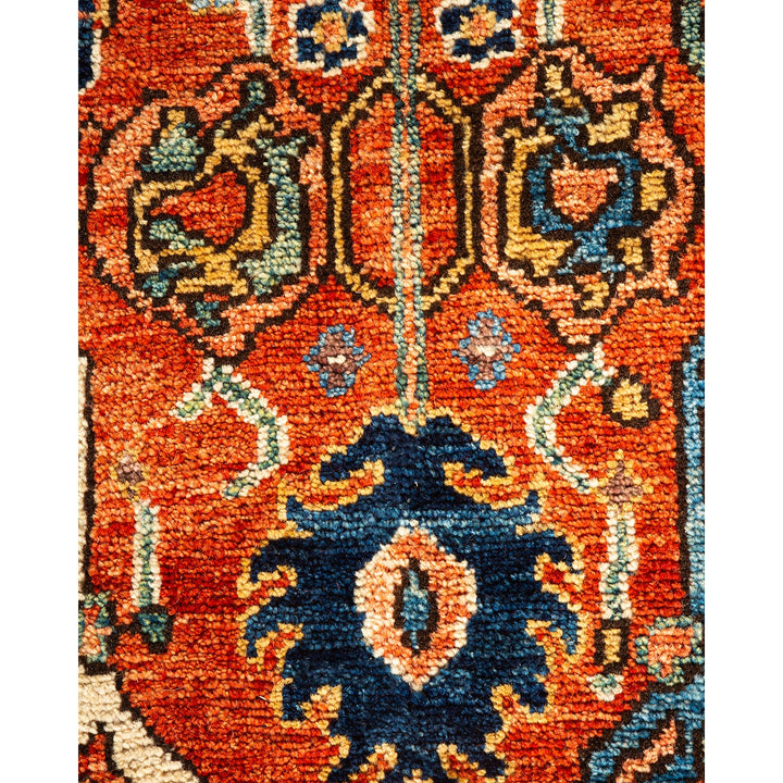 Close-up of a handwoven, intricate Persian/Oriental rug in vibrant colors.